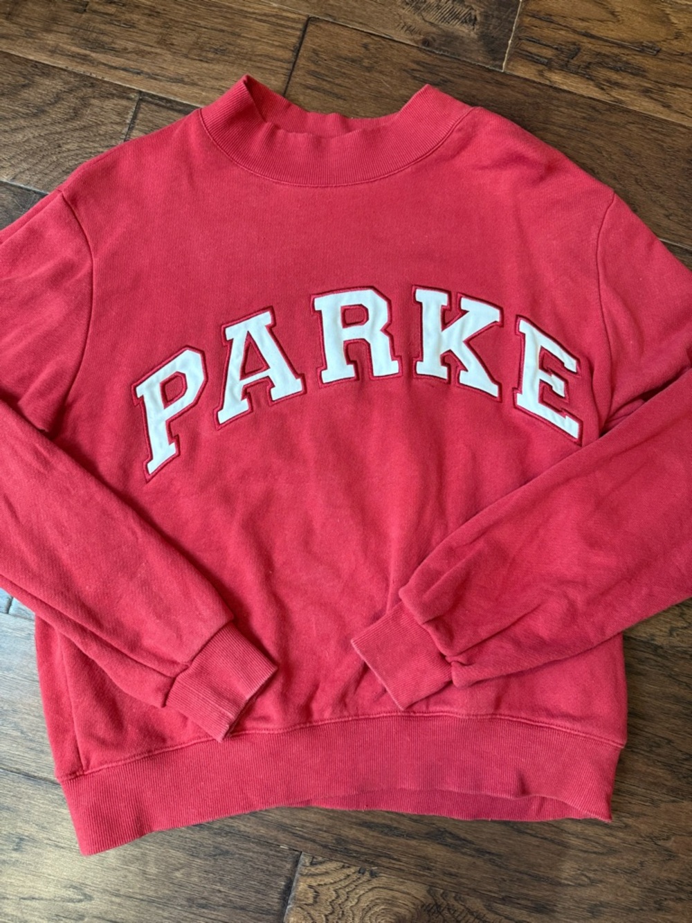 Parker Red Ribbed Collar Sweatshirt with Green Logo Tag